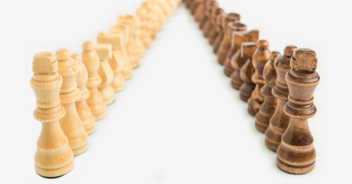 two lines of chess pieces converging into one line